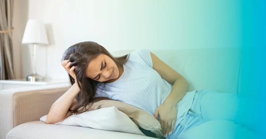 que es la colitis y causas imagen de mujer con dolor